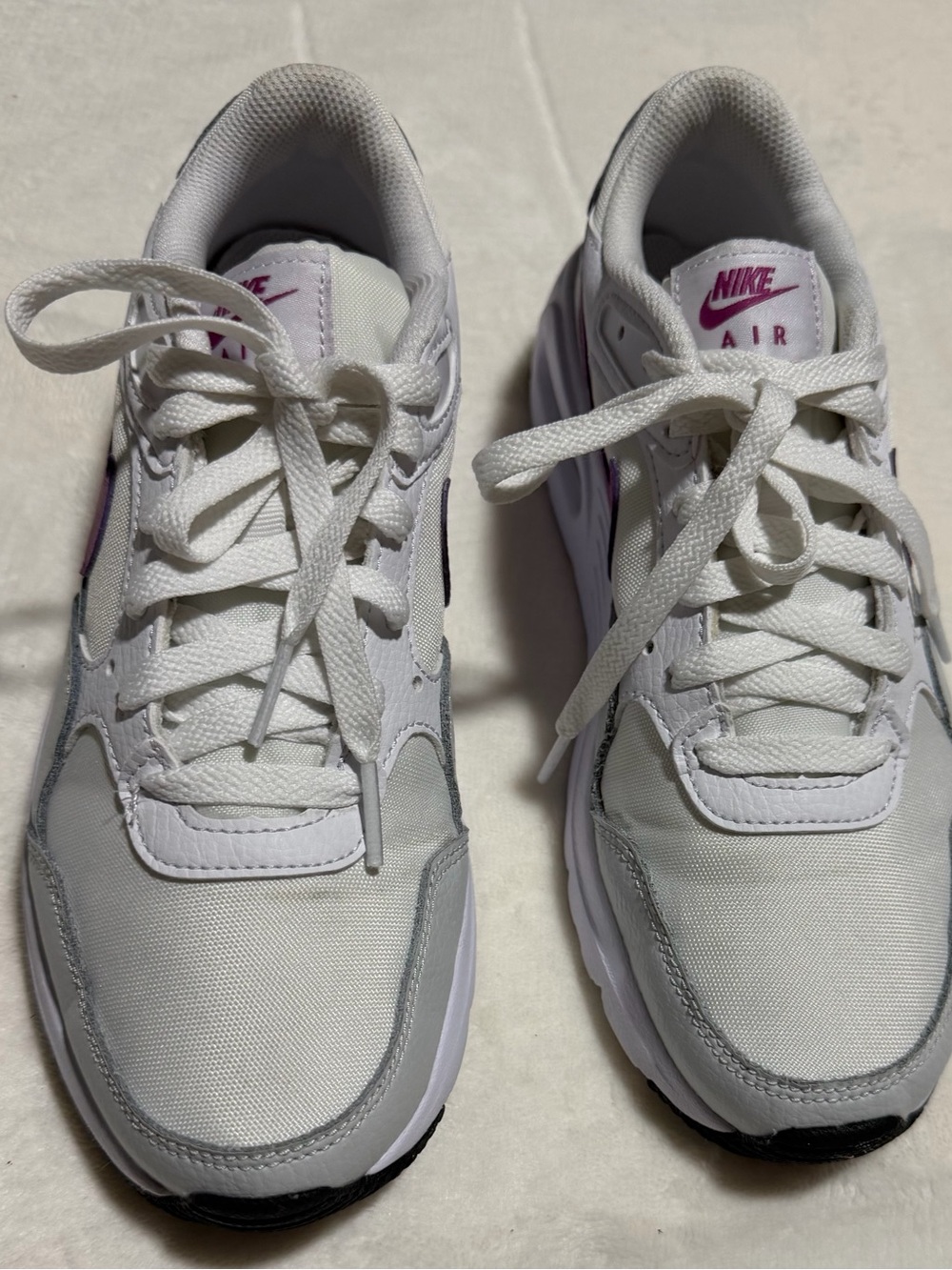Nike Women's White Sneakers with Purple Accents